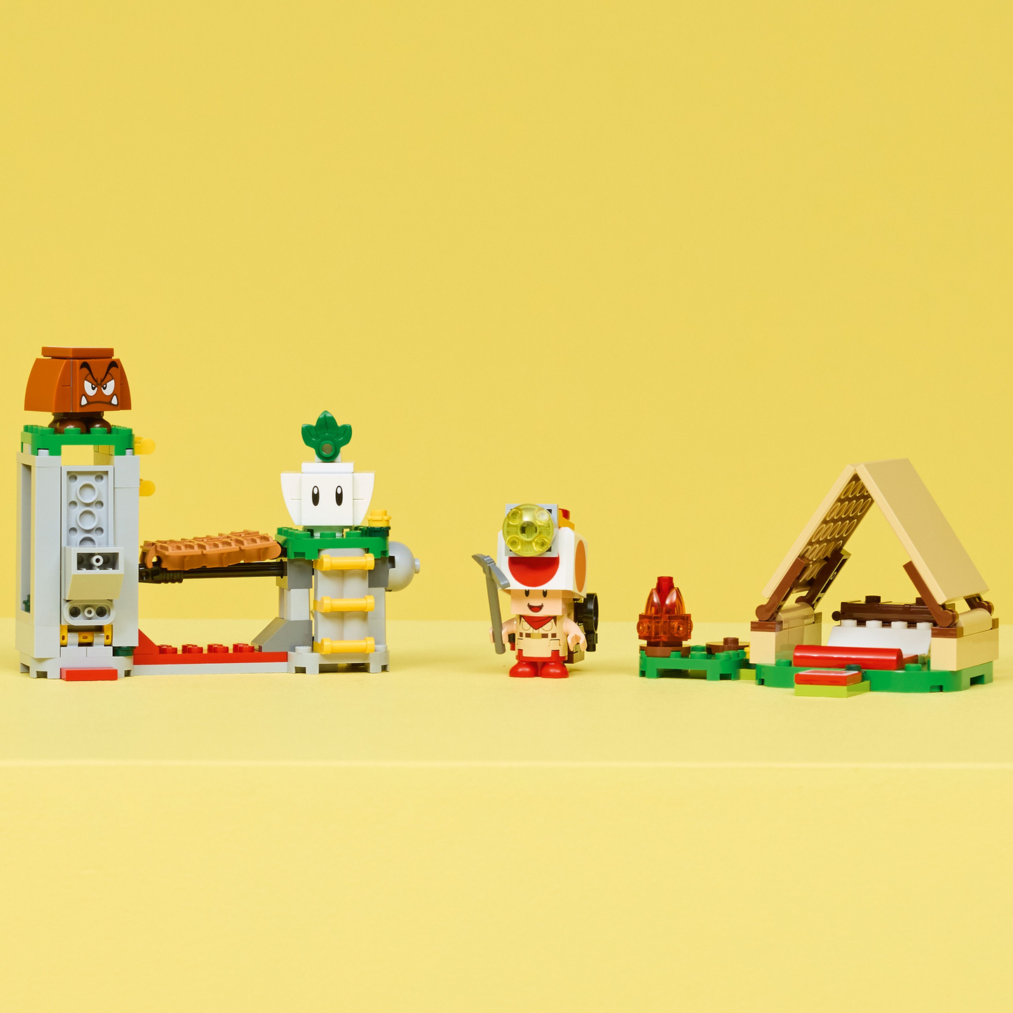 LEGO characters and structures on a yellow background.