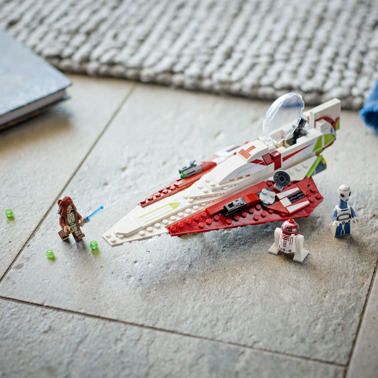 LEGO Star Wars set with spaceship and figures on a tiled floor.