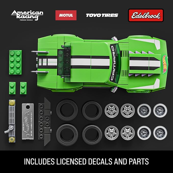 Green toy car set with components and branded logos on a black background