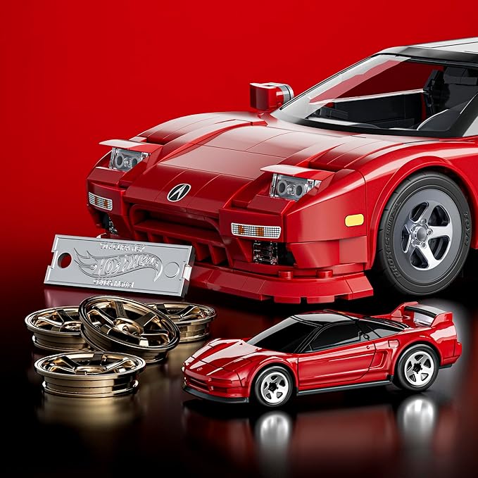 Red toy car with additional parts on a red background