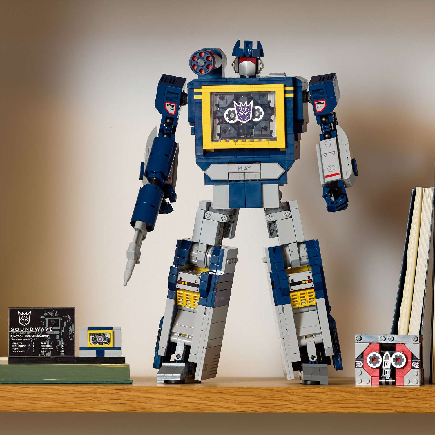 Toy robot figure on a wooden surface with a blurred background