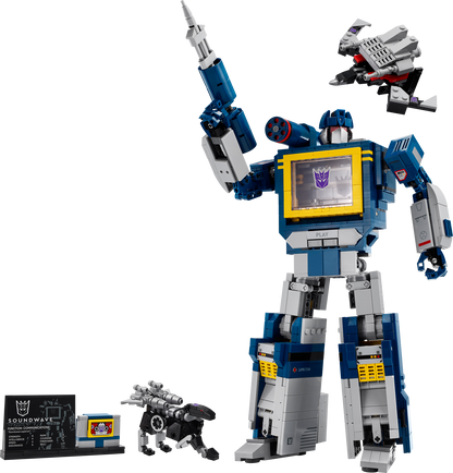 Toy robot figure with a smaller robot and packaging on a white background