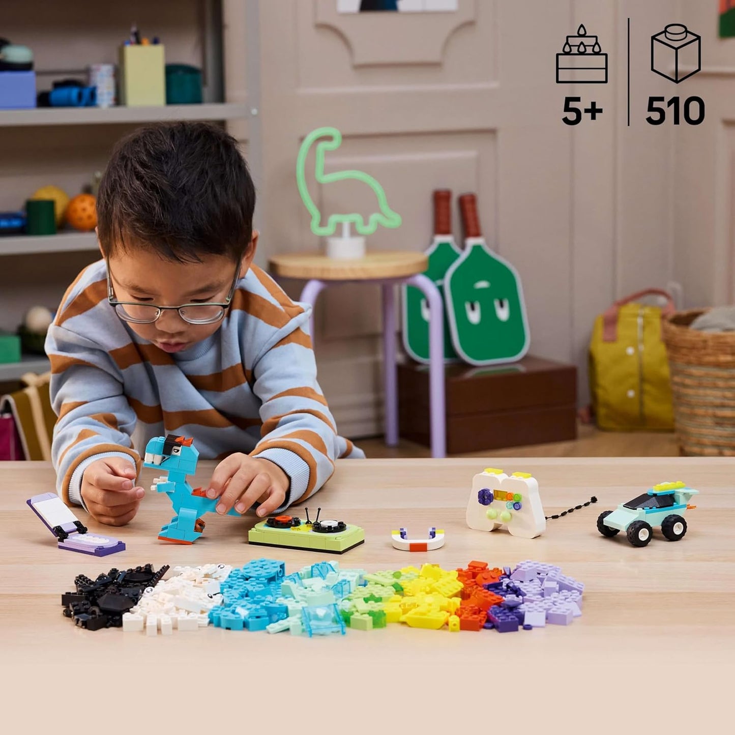 Child playing with LEGO Classic Cool Creative Box Set, on a table 