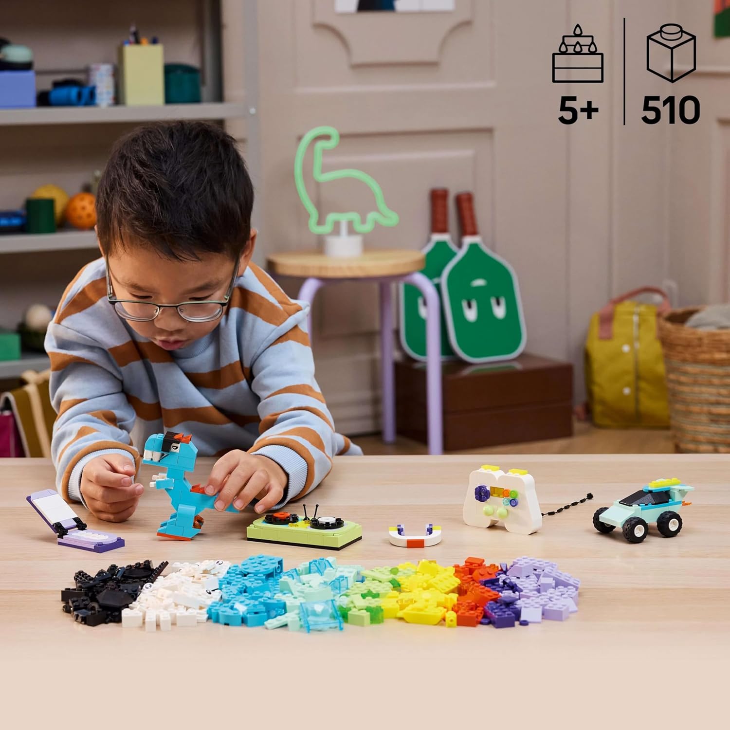 Child playing with LEGO Classic Cool Creative Box Set, on a table 