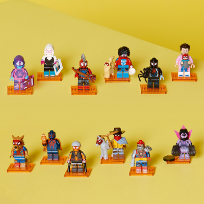 Collection of colorful LEGO spiderman minifigures on a yellow background
