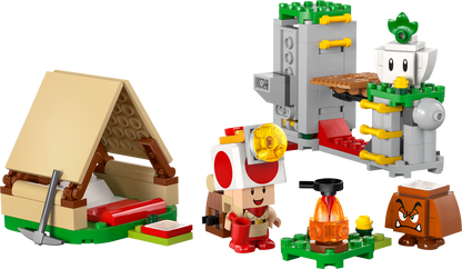 LEGO set with a small hut, character, and other elements on a white background.