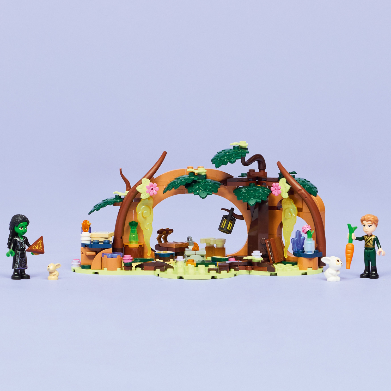 LEGO Wicked Elphaba's Retreat set with characters and a fantasy scene including a wooden arch and plants.