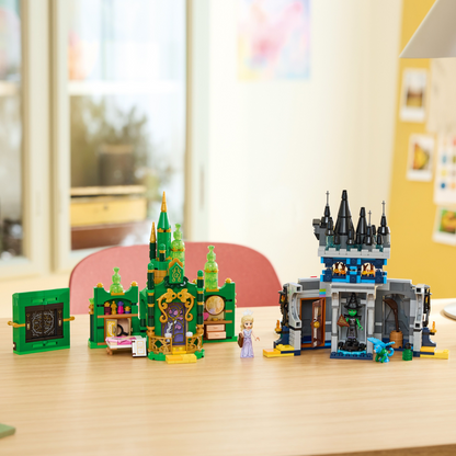 Two toy castle sets on a table with a blurred indoor background