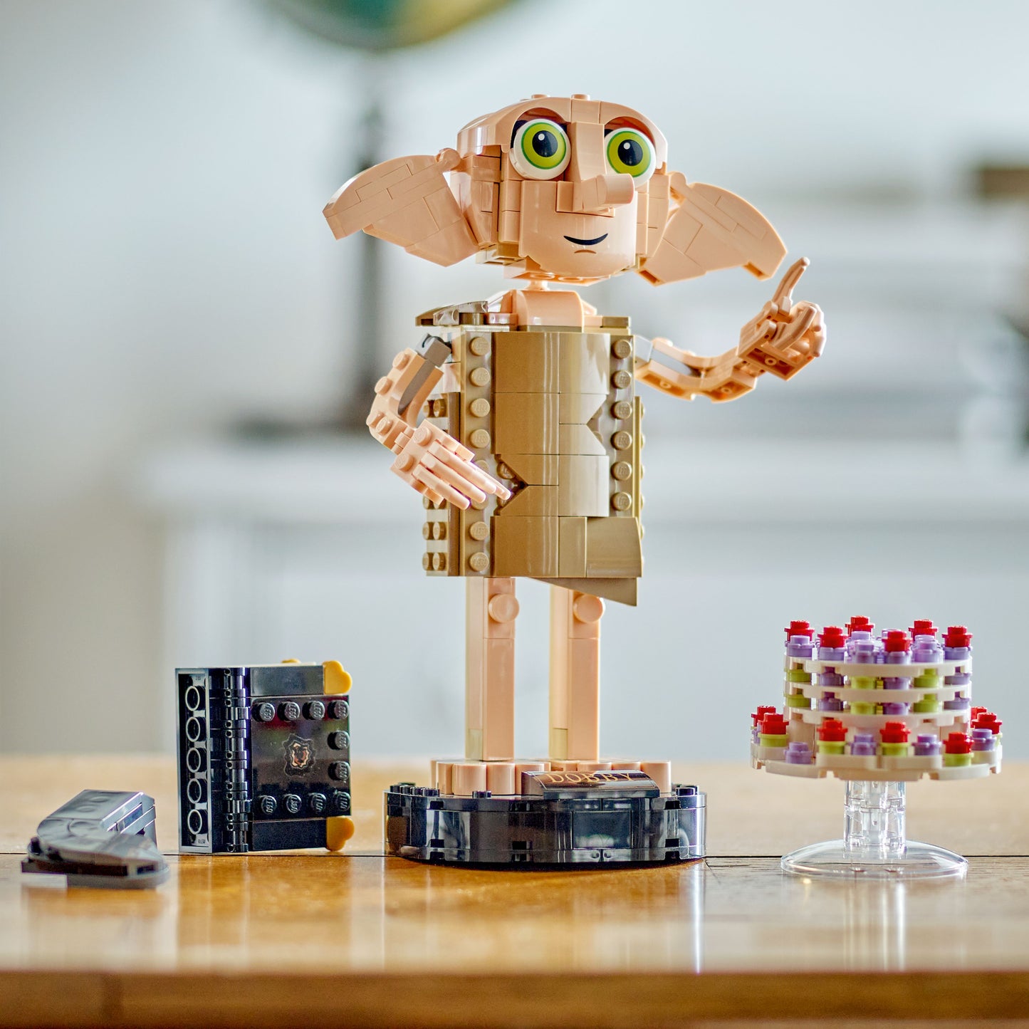 LEGO Dobby the House Elf set with cake on a table 