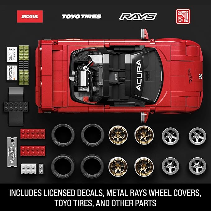 Red Acura model car with components on a black background, featuring Motul, Toyo Tires, and Rays logos.