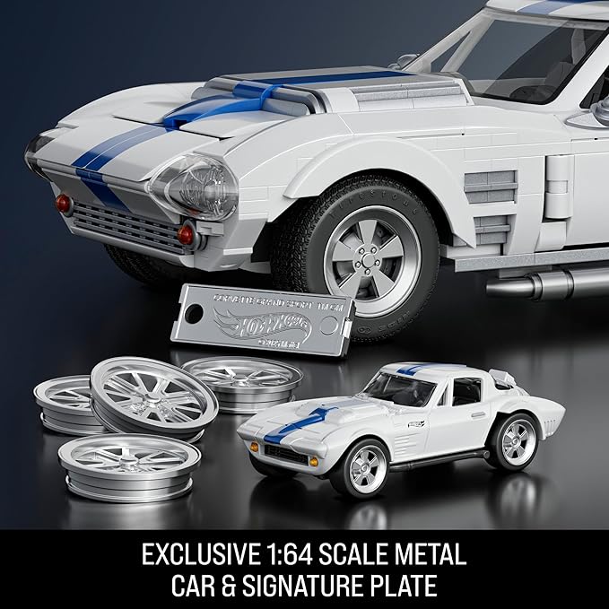 Model car set with wheels and signature plate on a dark background