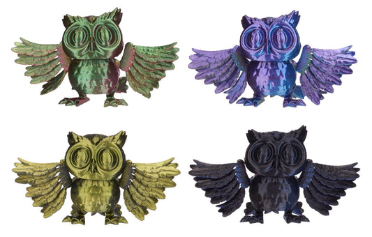 Four colorful owl figurines on a white background